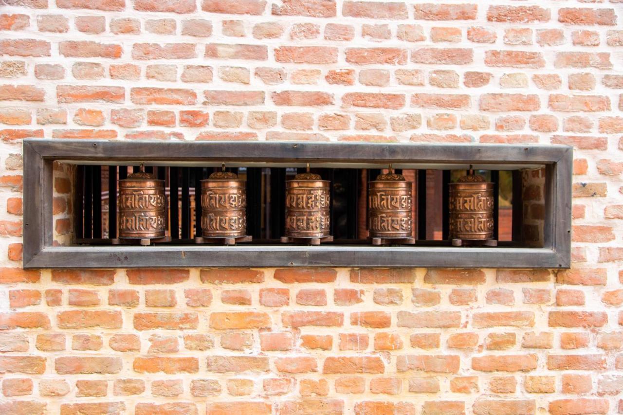 Basera Boutique Hotel Catmandu Exterior foto Prayer wheels at the temple